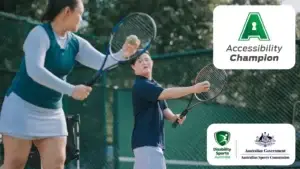 Two people playing tennis together on an outdoor court. Accessibility Champion logo and partner logos appear on the right.